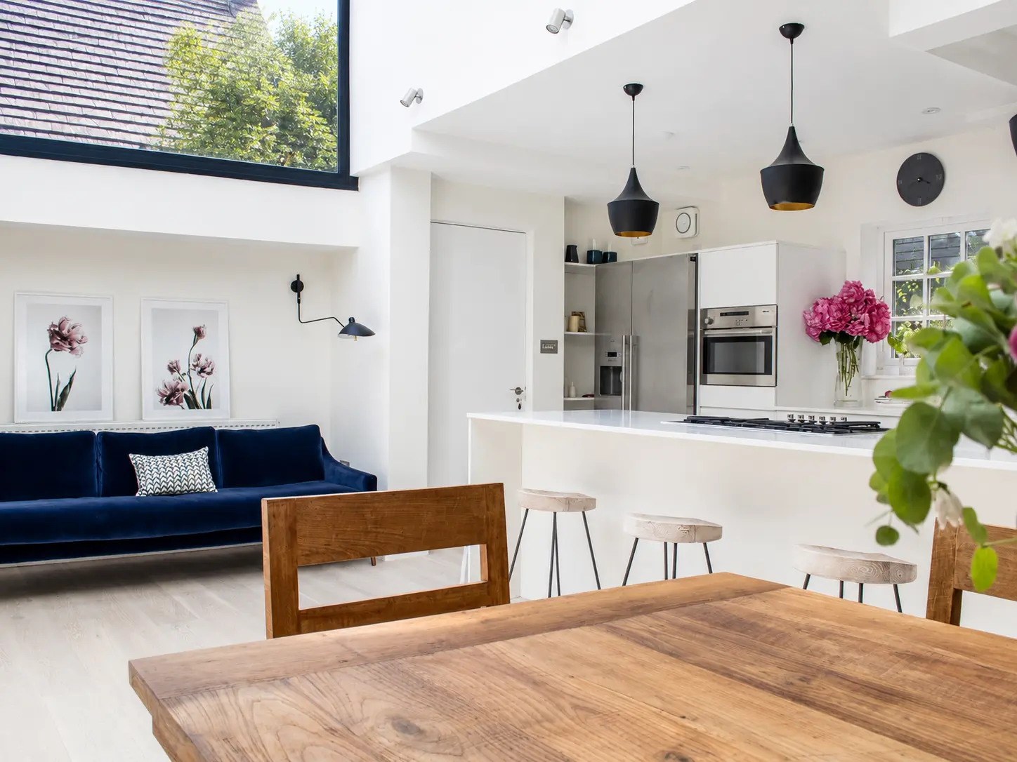 A bright open-plan kitchen and dining room by Rex & Co — Ranulf Road, London